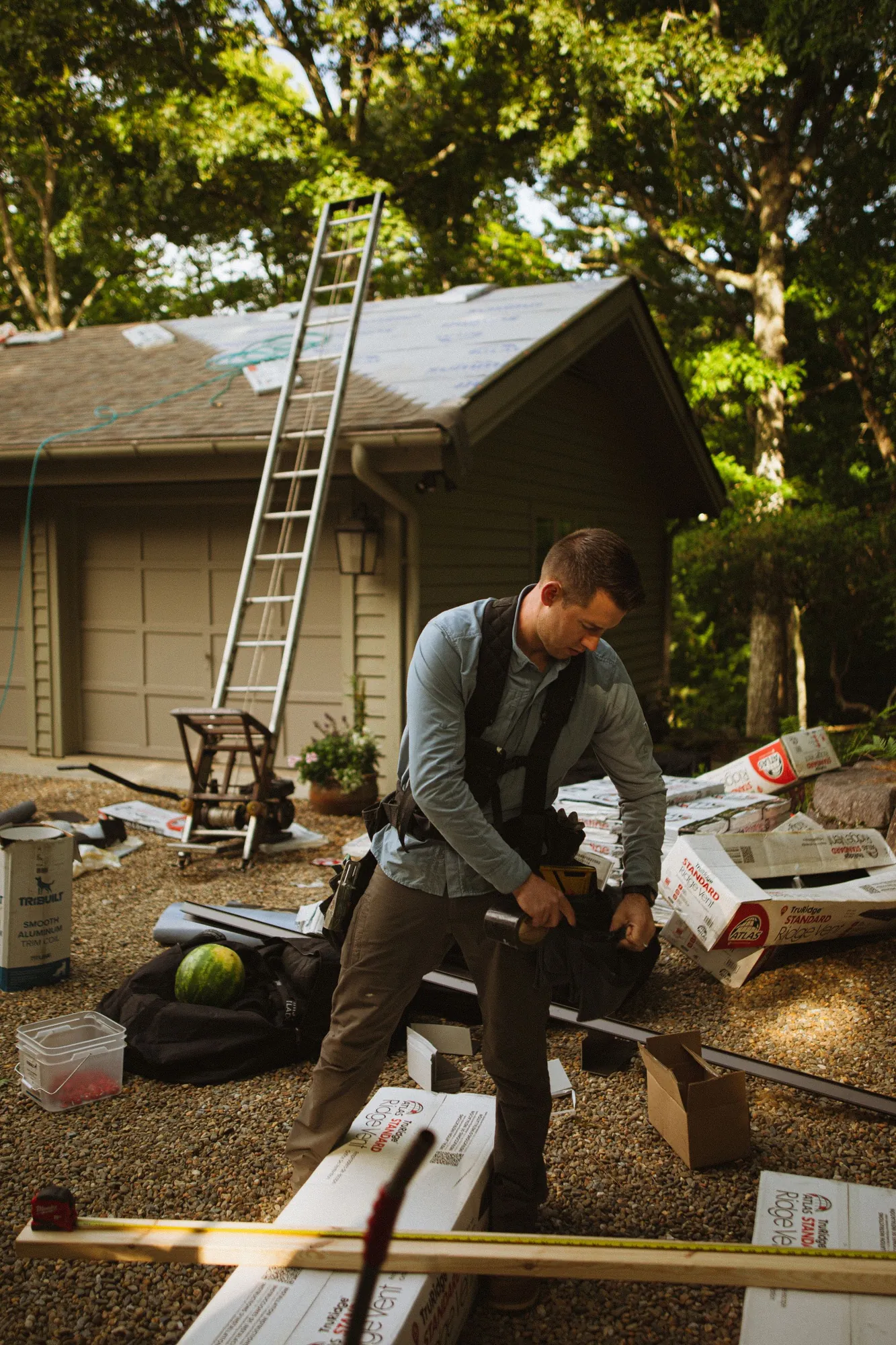 Roofing contractor at work on a residential job site