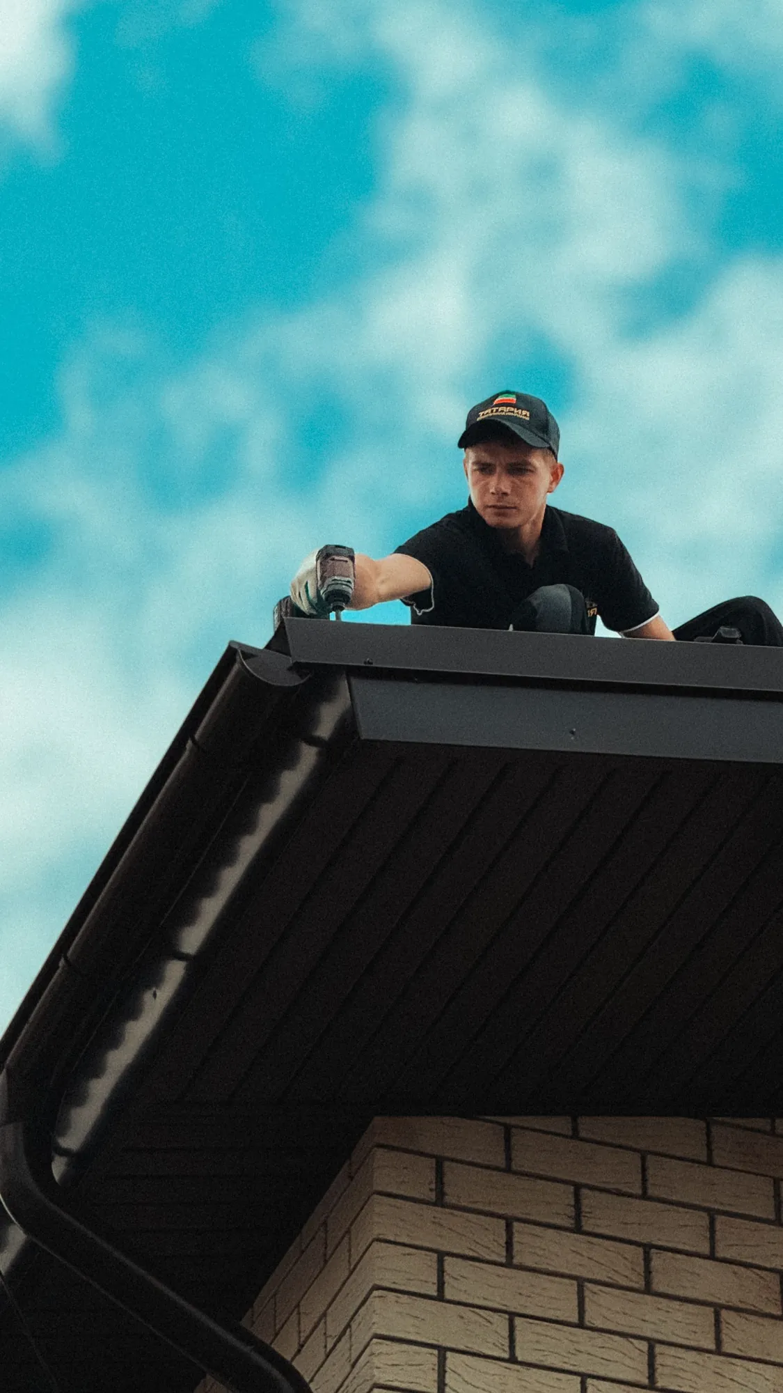 Roofer working at the edge of a roof